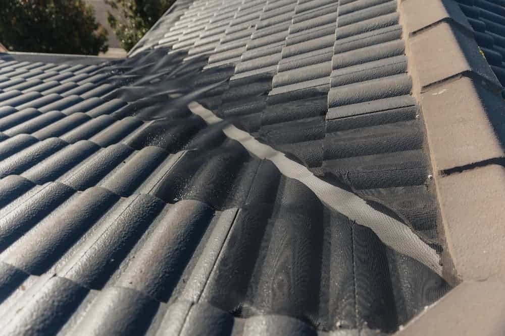 Tile roof valley gutter guard